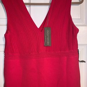Coral color fitted dress.